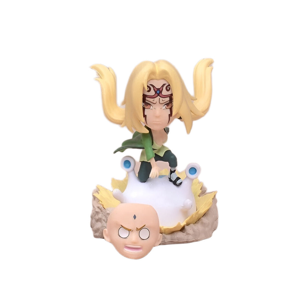 Animated character figurine with a head-shaped base on a white background