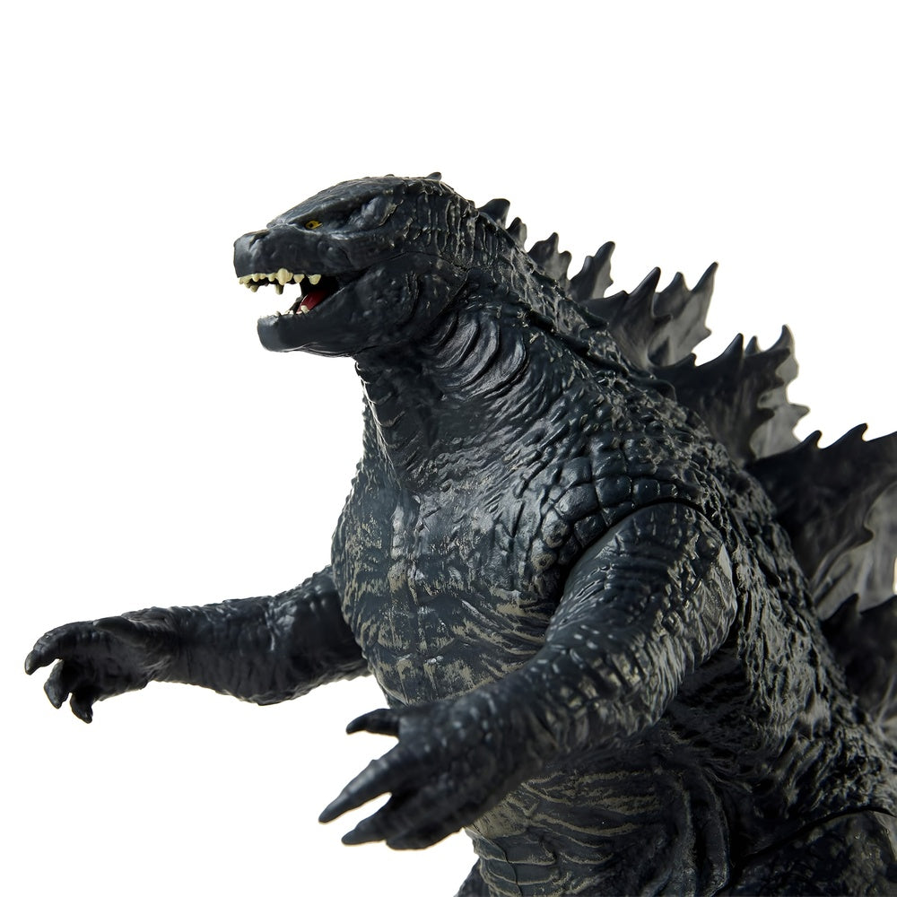 Godzilla action figure on a white background