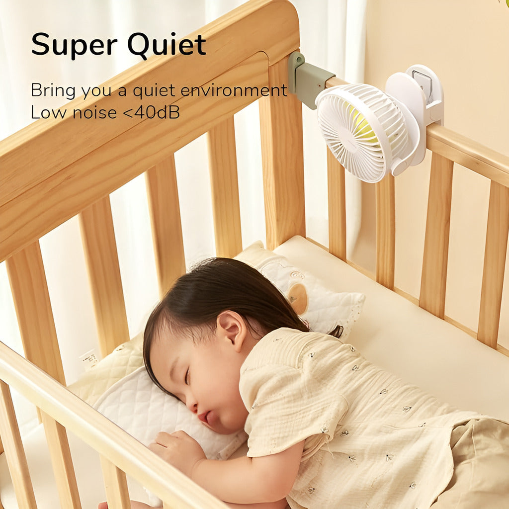 Baby sleeping in a crib with a small fan labeled 'Super Quiet' and 'Low noise <40dB'.