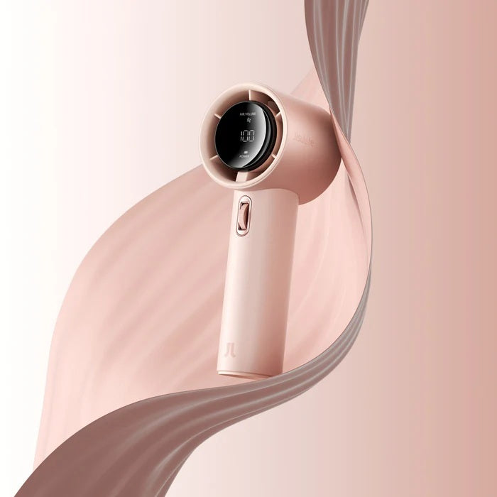 Rose gold hair dryer with digital display on a pink background