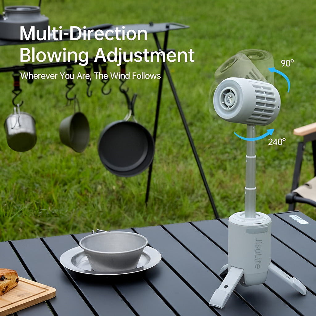 Outdoor wind device with adjustable direction on a table, with camping equipment in the background.