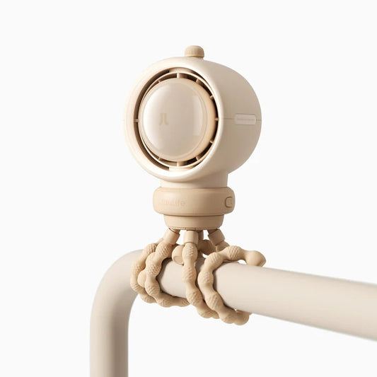 Beige curtain holder with decorative elements on a white background