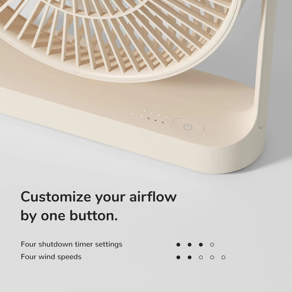 Beige handheld fan with control buttons on a light gray background