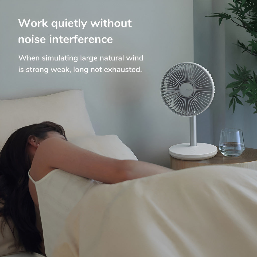 Person lying in bed with a small fan on a nightstand, text about noise interference.