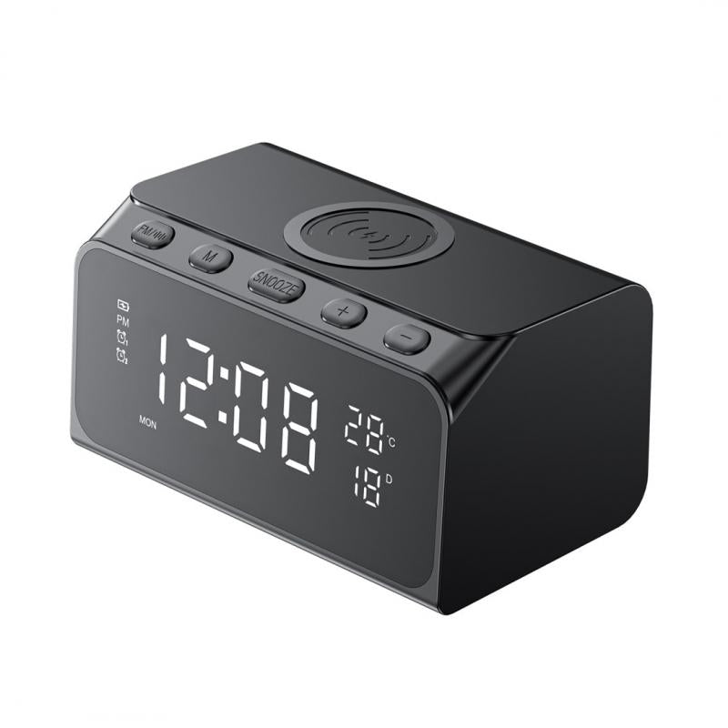 Black digital clock with wireless charging pad on a white background