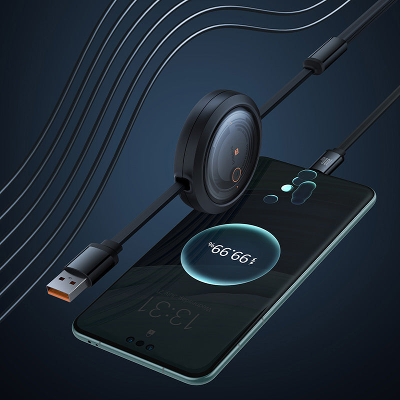 Smartphone with wireless charging pad and USB cable on a dark background