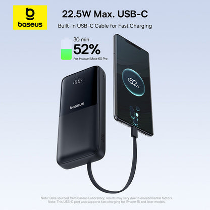 Baseus power bank with USB-C cable charging a smartphone on a light blue background