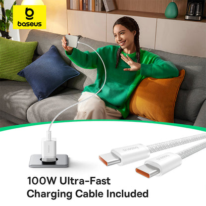 Woman sitting on a couch using a smartphone with a charging cable, Baseus logo visible.