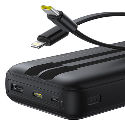 Black power bank with multiple ports and a cable on a white background