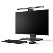 Black computer monitor with keyboard and mouse on a white background