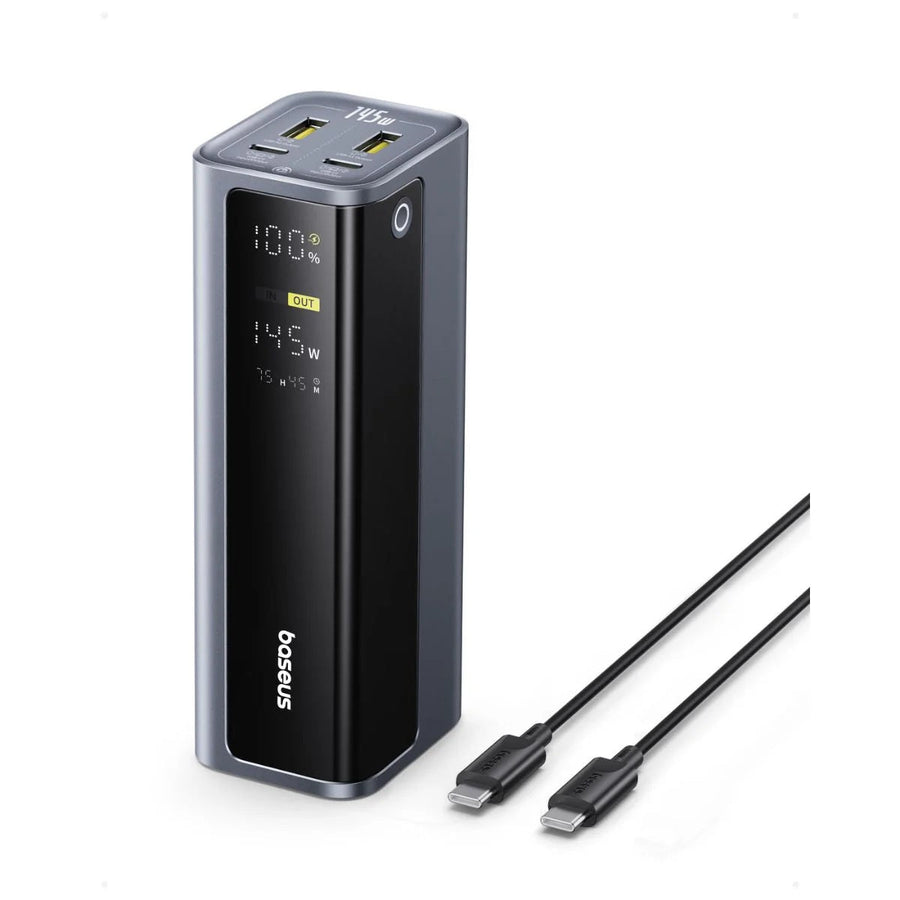 Black power bank with digital display and USB cable on a white background