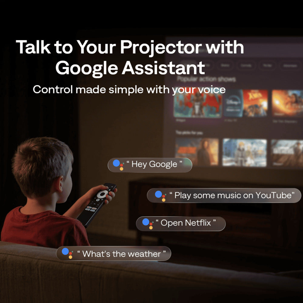 Aurzen Boom Air Portable 1080p Google TV Projector Person using a remote control to interact with a projector displaying Google Assistant commands.