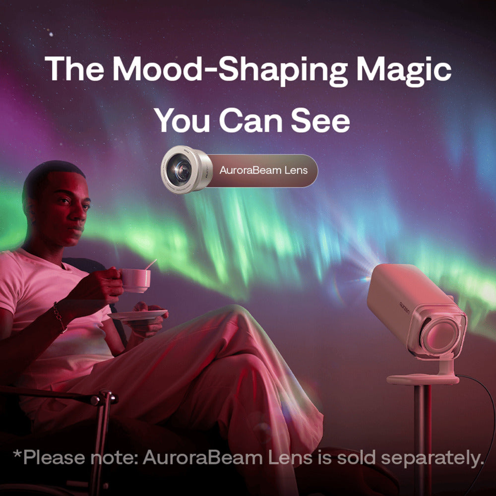 Aurzen Boom Air Portable 1080p Google TV Projector Person sitting with a cup, AuroraBeam Lens projector, and projected Northern Lights on a dark background.