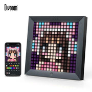 Divoom Pixoo 16×16 RGB Pixel LED Display (Smart App, Desktop & Wall Mount) Pixel art display with smartphone showing pixel art app and displayed artwork.