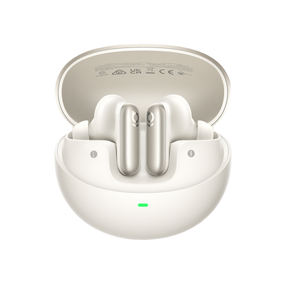 White wireless earbuds in an open charging case on a white background