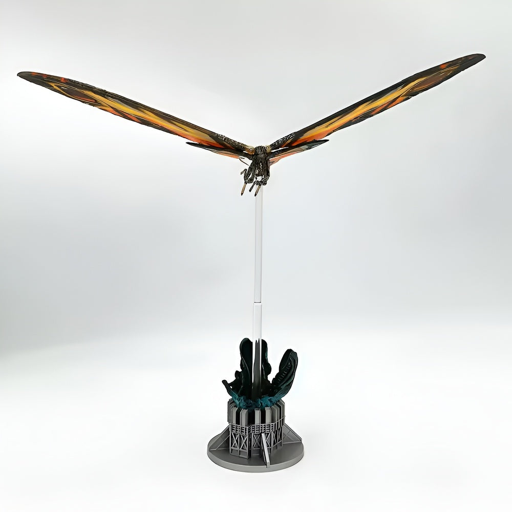 Model of a dragon on a stand with a white background