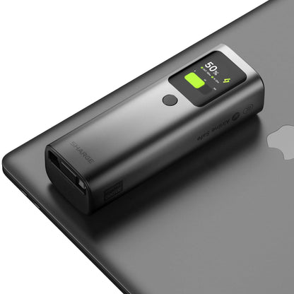 Sharge Retractable 165W Power Bank (20000mAh, Built‑in 100W USB‑C Cable) Black power bank with digital display on a gray surface