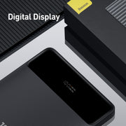 Baseus Blade Digital Display Quick Charge Power Bank 20000mAh 100W Black power bank with digital display on a gray surface, featuring the Baseus brand.