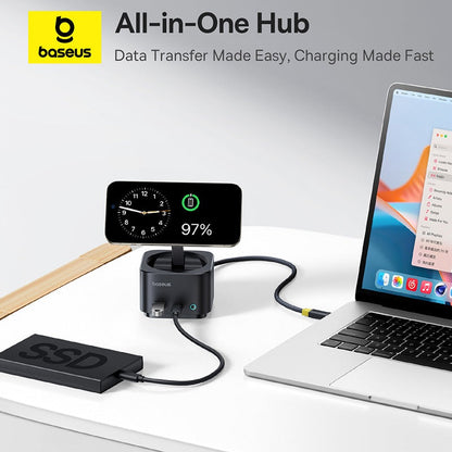 Baseus all-in-one hub with smartphone, clock, and laptop on a white surface.