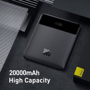 Black power bank with digital display on a dark surface, featuring the brand '100W'.
