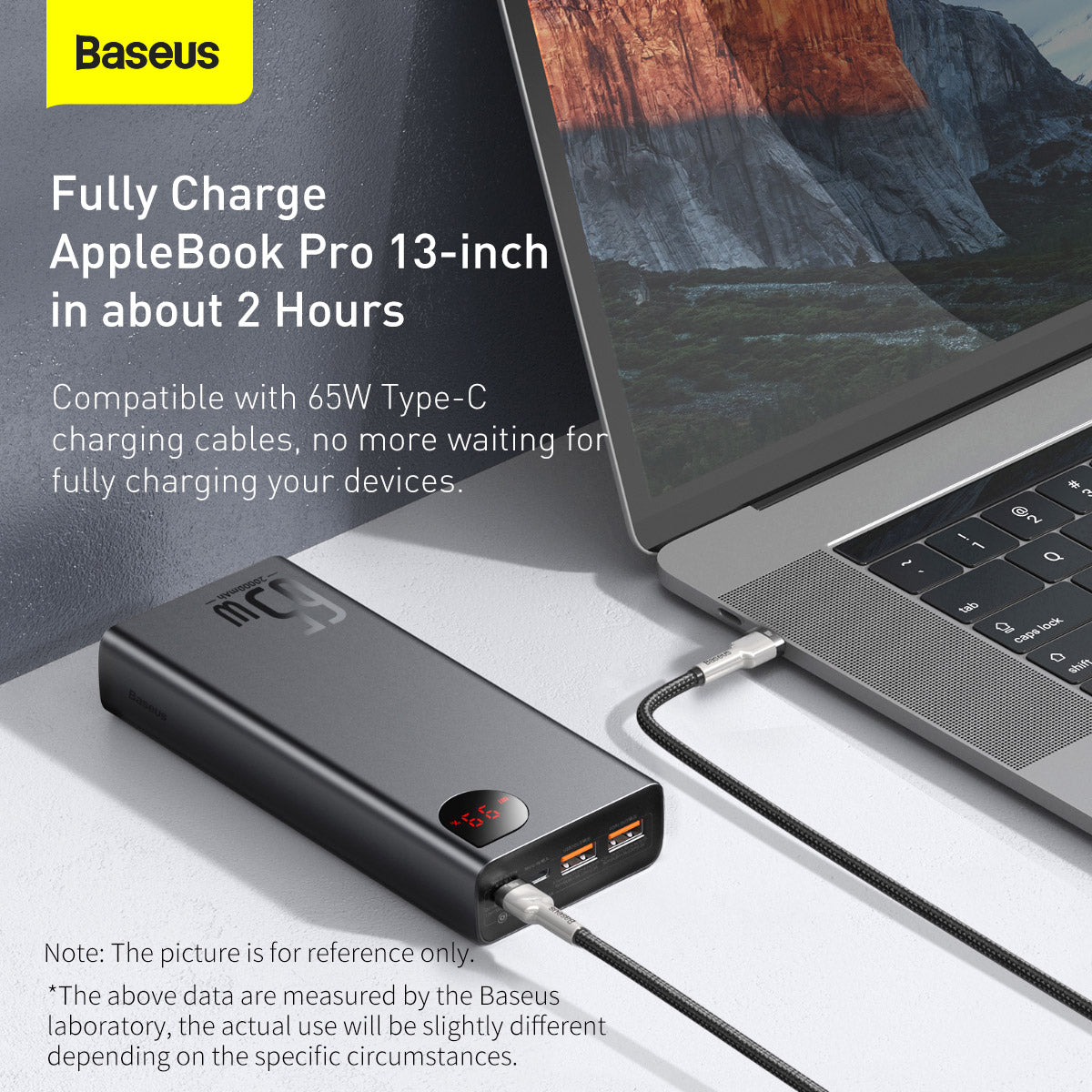 Baseus Adaman Series Laptop Power Bank 65W 20000mAh charging an AppleBook Pro 13-inch laptop on a white surface.