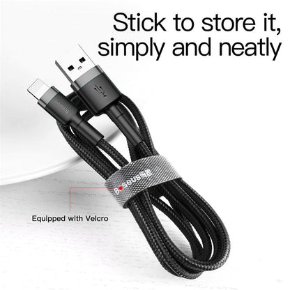 Coiled USB cable with a Velcro strap on a white background