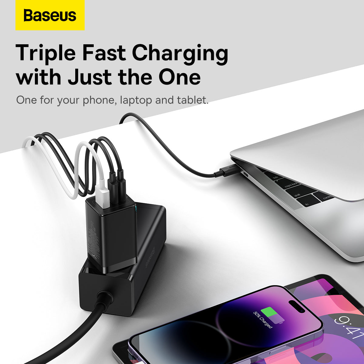 Baseus triple fast charging adapter with smartphone, laptop, and tablet on a white background