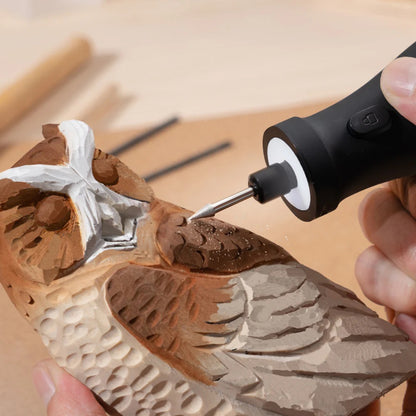 HOTO 12V Rotary Tool Kit Pro, Person using a carving tool to shape a wooden sculpture of a bird.