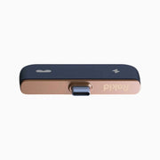Rokid Hub USB‑C Adapter (Pass‑Through Charging, Switch Dock Mode, Dual USB‑C Out) Black and rose gold USB adapter with 'RIO' branding on a white background