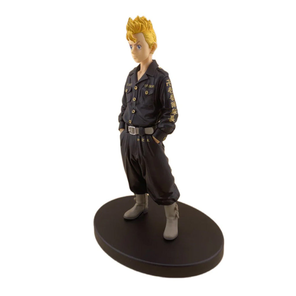 Figurine of an animated character in a black outfit with gold accents on a white background gadgettime