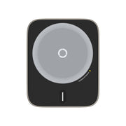 Black electronic device with circular gray center on a white background