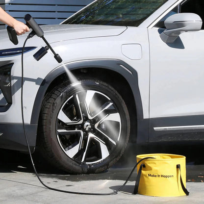 HOTO Outdoor Wash Kit, Person cleaning a car tire with a pressure washer, next to a yellow bucket with 'Make It Happen' text.