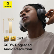Person wearing headphones with Baseus logo and text about audio resolution upgrade.