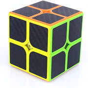 Rubik's Cube with black sides and green and orange edges on a white background
