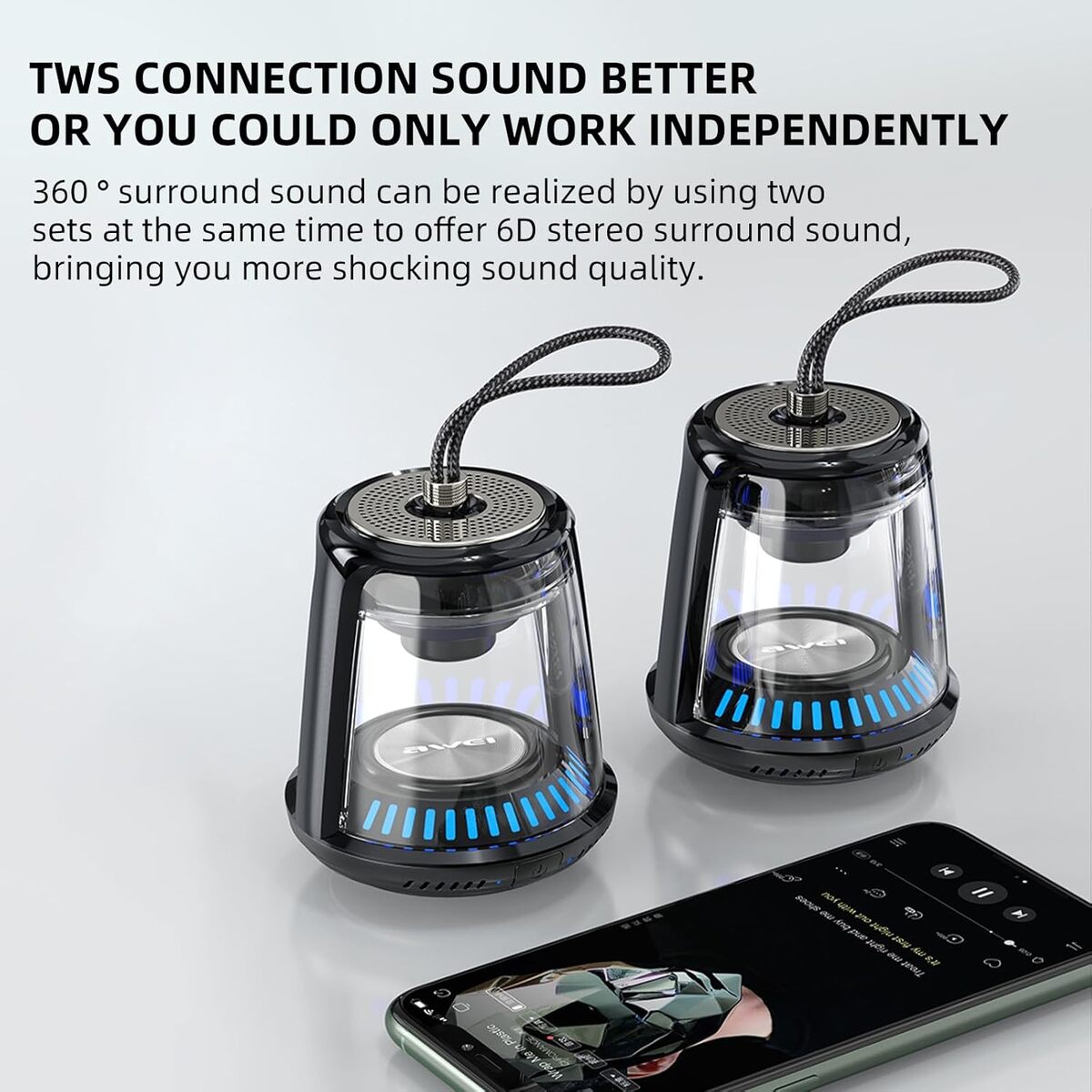 Two black and transparent speakers with blue LED lights on a white background, next to a smartphone.