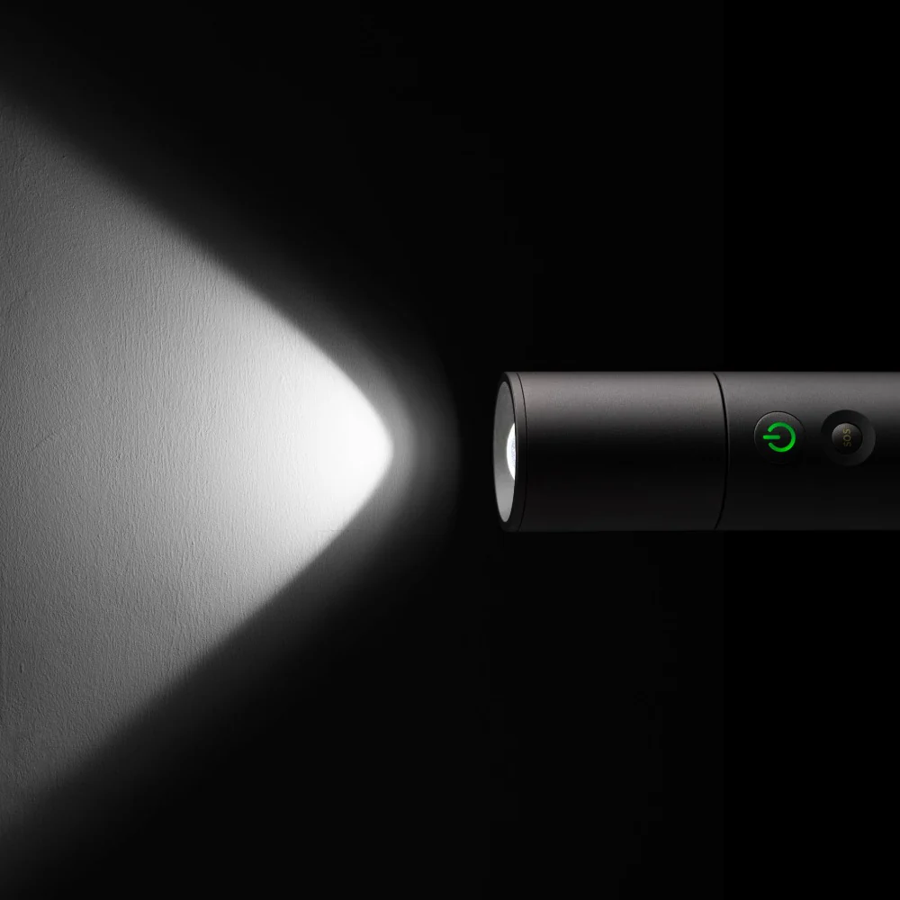 HOTO Flashlight Lite 1000 Lumens Rechargeable Torch Flashlight emitting a beam of light on a dark background