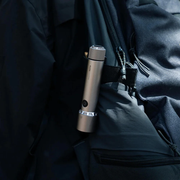HOTO Flashlight Tactics 2300 Tactical Rechargeable Torch Silver flashlight held against a dark background