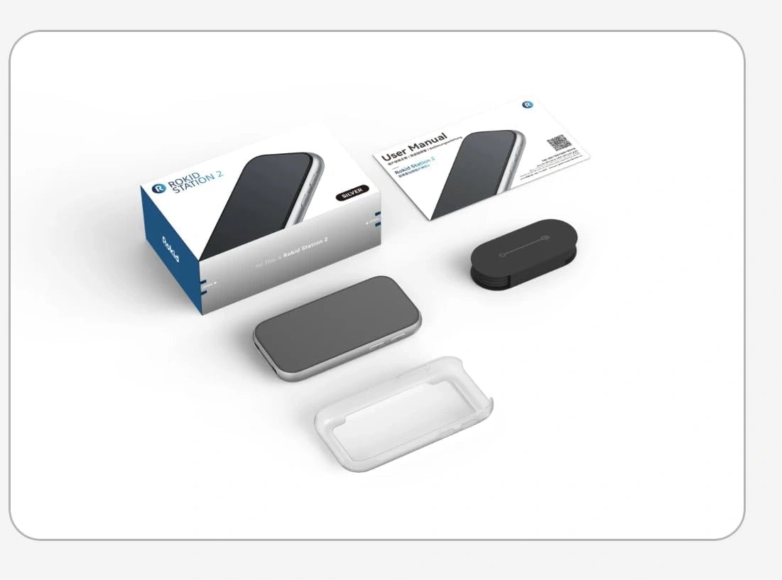 Rokid Station 2 Spatial Computing Hub (3‑Screen AR, Snapdragon 6 Gen 1, 5000mAh) Tech product packaging with accessories on a white background