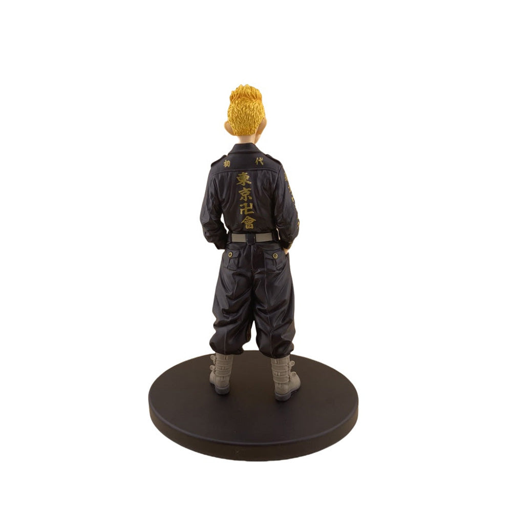 Figure in black outfit with yellow hair on a white background