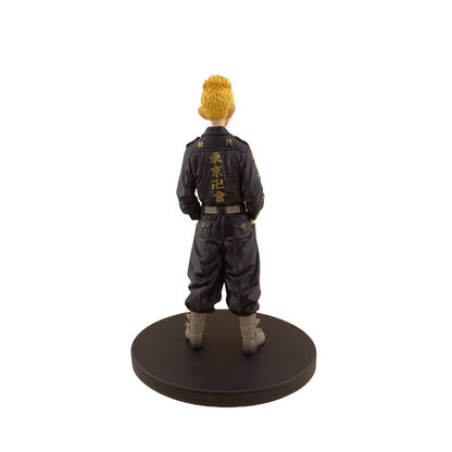 Figure in black outfit with yellow hair on a white background