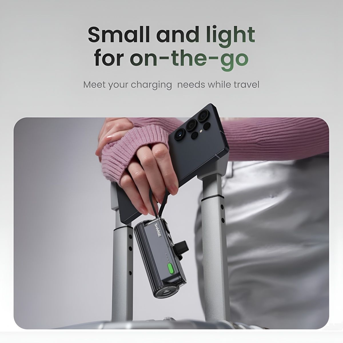 Sharge Flow Mini 2 22.5W Power Bank (5000mAh, Built‑in USB‑C & Lightning) Hand holding a smartphone with a charging device attached, on a travel bag background.