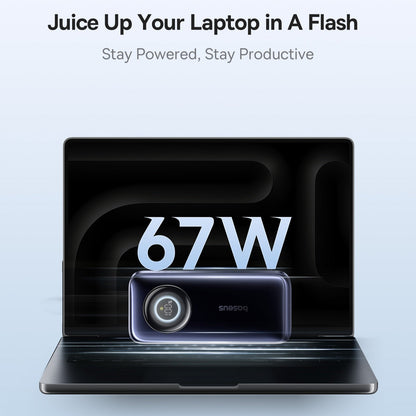 Laptop with a power adapter displaying '67W' on a light blue background.