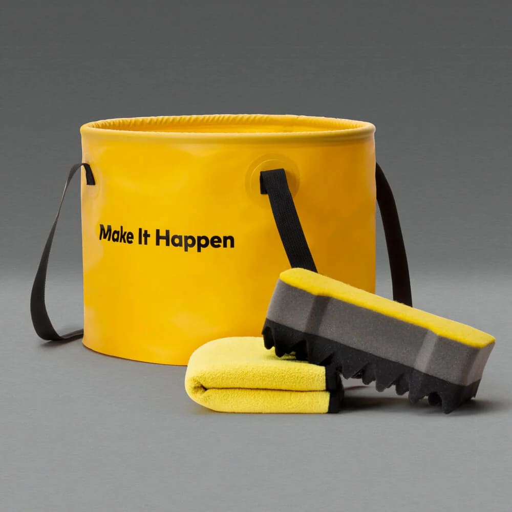 HOTO Outdoor Wash Kit, Yellow bucket with 'Make It Happen' text, brush, and towel on a gray background