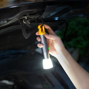 HOTO Flashlight Lite 1000 Lumens Rechargeable Torch Hand holding a flashlight under a car hood at night