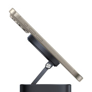 Smartphone on a black stand against a white background