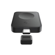 Black electronic device with a detachable component on a white background