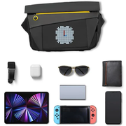 Divoom Pixoo Slingbag‑V Smart LED Sling Bag (4.7" Pixel Screen, App Control) Black crossbody bag with pixelated design, smartwatch, airpods, sunglasses, wallet, tablet, phone, and gaming console on a white background.