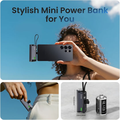 Sharge Flow Mini 2 22.5W Power Bank (5000mAh, Built‑in USB‑C & Lightning) Person holding a smartphone with a mini power bank attached, against a clear blue sky.