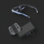 Rokid Hub USB‑C Adapter (Pass‑Through Charging, Switch Dock Mode, Dual USB‑C Out) Smart glasses with a controller and tablet on a dark background
