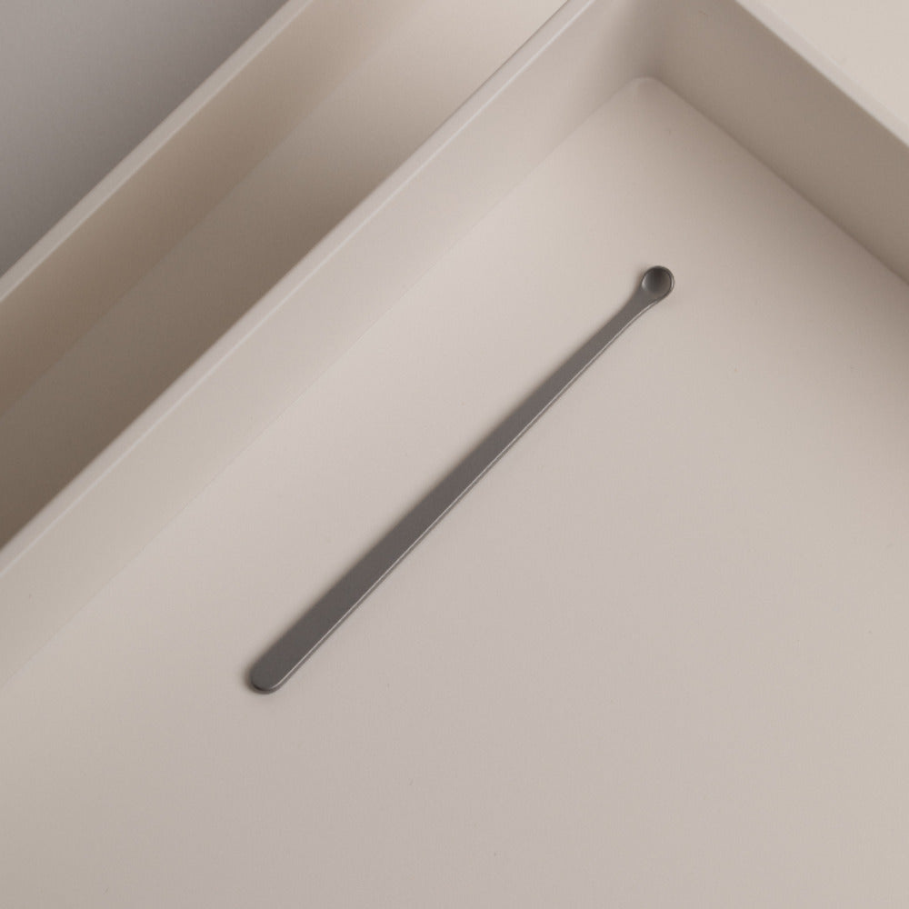 HOTO Clicclic Three-piece Nail Clipper, Long, thin metal object on a light beige surface